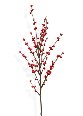 Artificial red berry branch on a white background