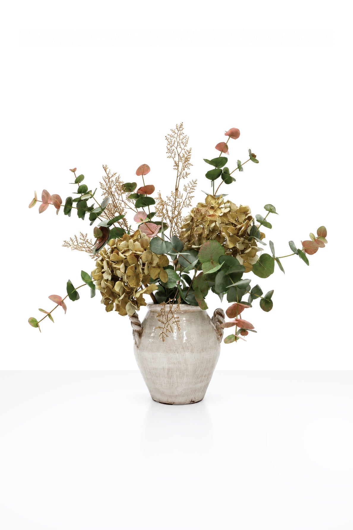 Artificial Autumn Brambles Arrangement in a white ceramic vase on white background