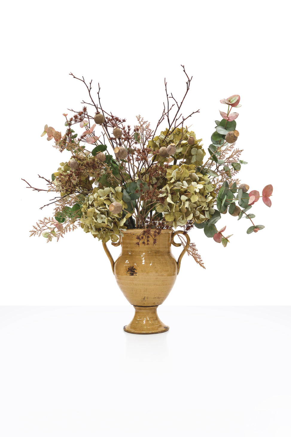 Artificial Autumn Brambles Arrangement in a mustard ceramic urn on white background