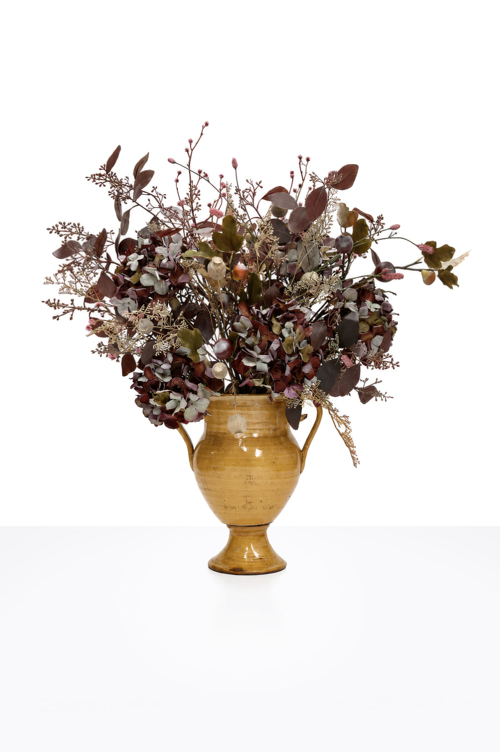 Artificial Autumn Mulberry Hydrangea Arrangement in a mustard ceramic urn on white background