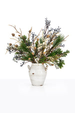 Artificial Christmas Blue Berry Arrangement in a ceramic urn on white background