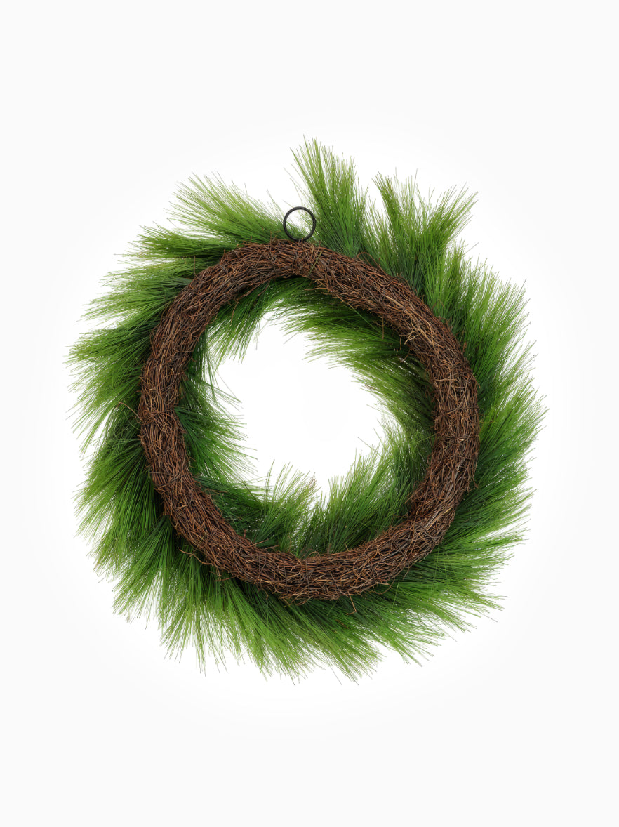 Back of a faux Christmas Pine wreath on white