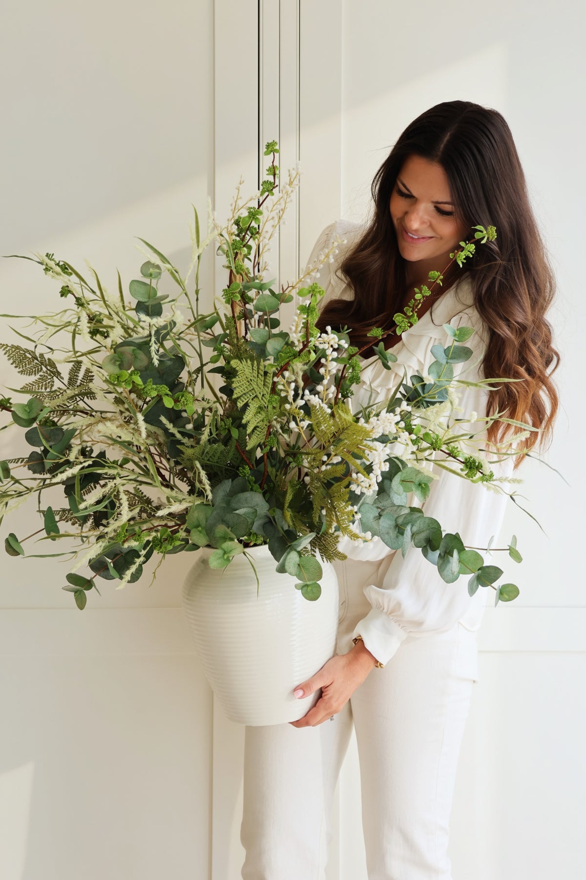 Ashlee Jane arranging seasonal flowers