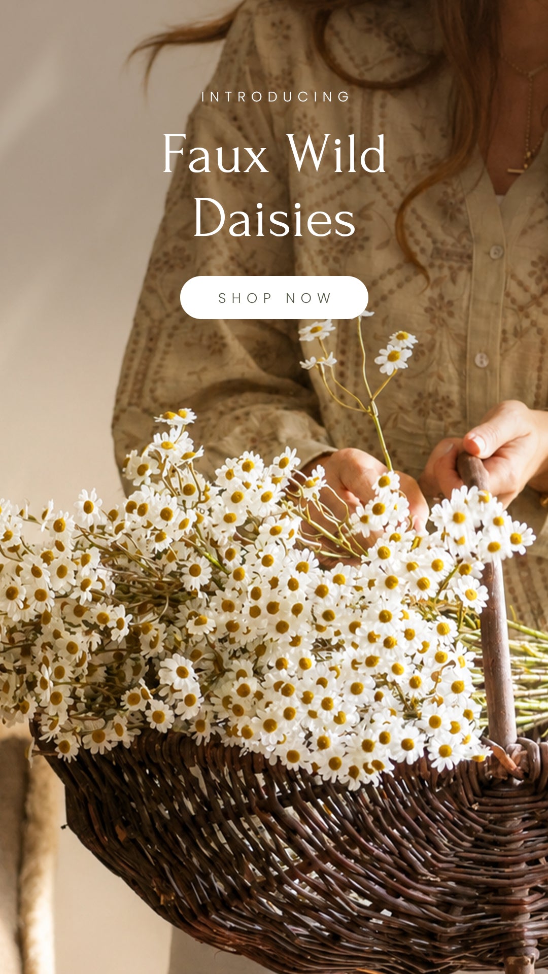 Person holding a basket of faux white daisies with promotional text overlay.