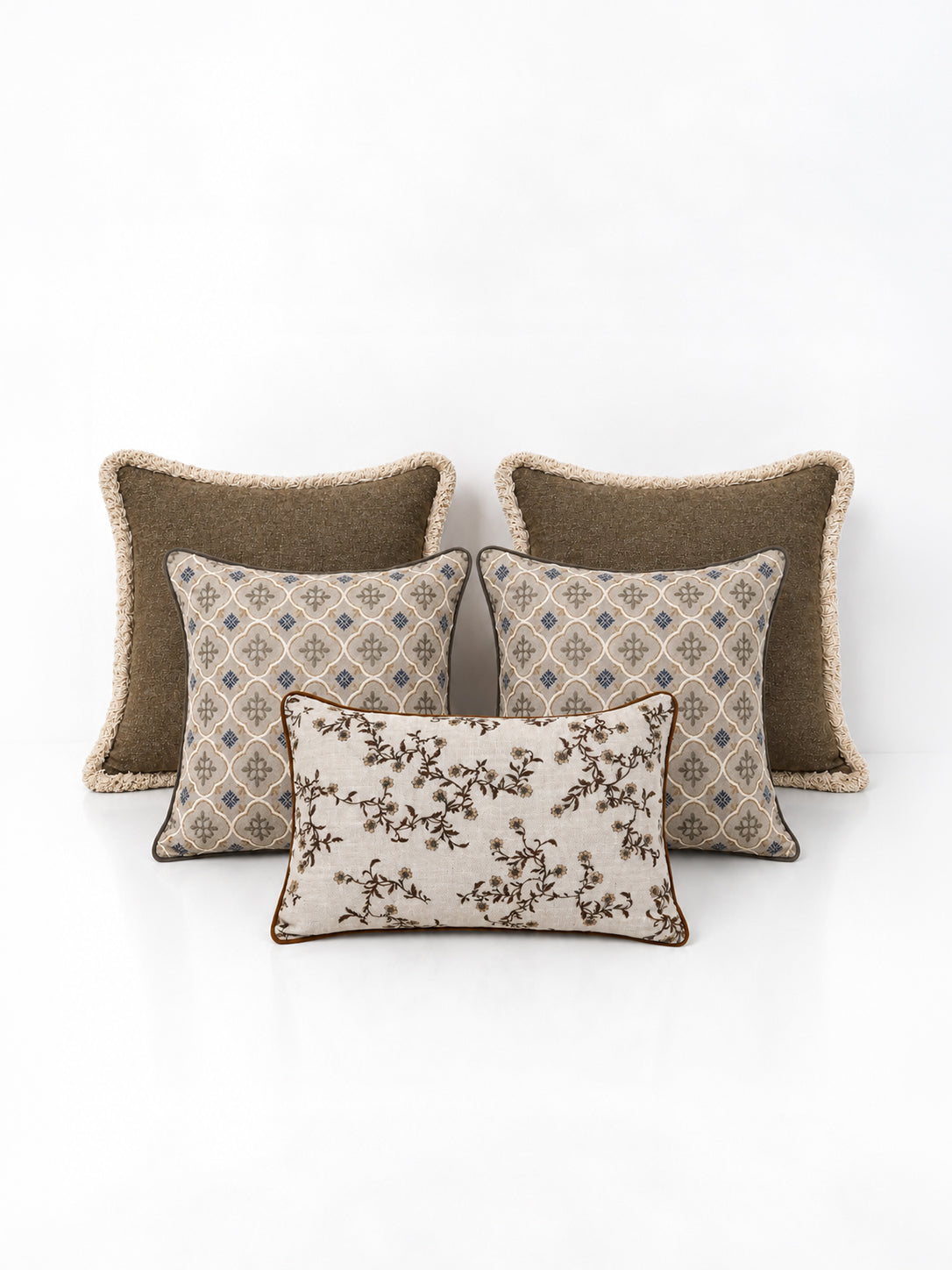 A set of sage decorative cushions on a white background