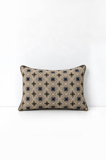 Decorative pillow with geometric pattern on a white background