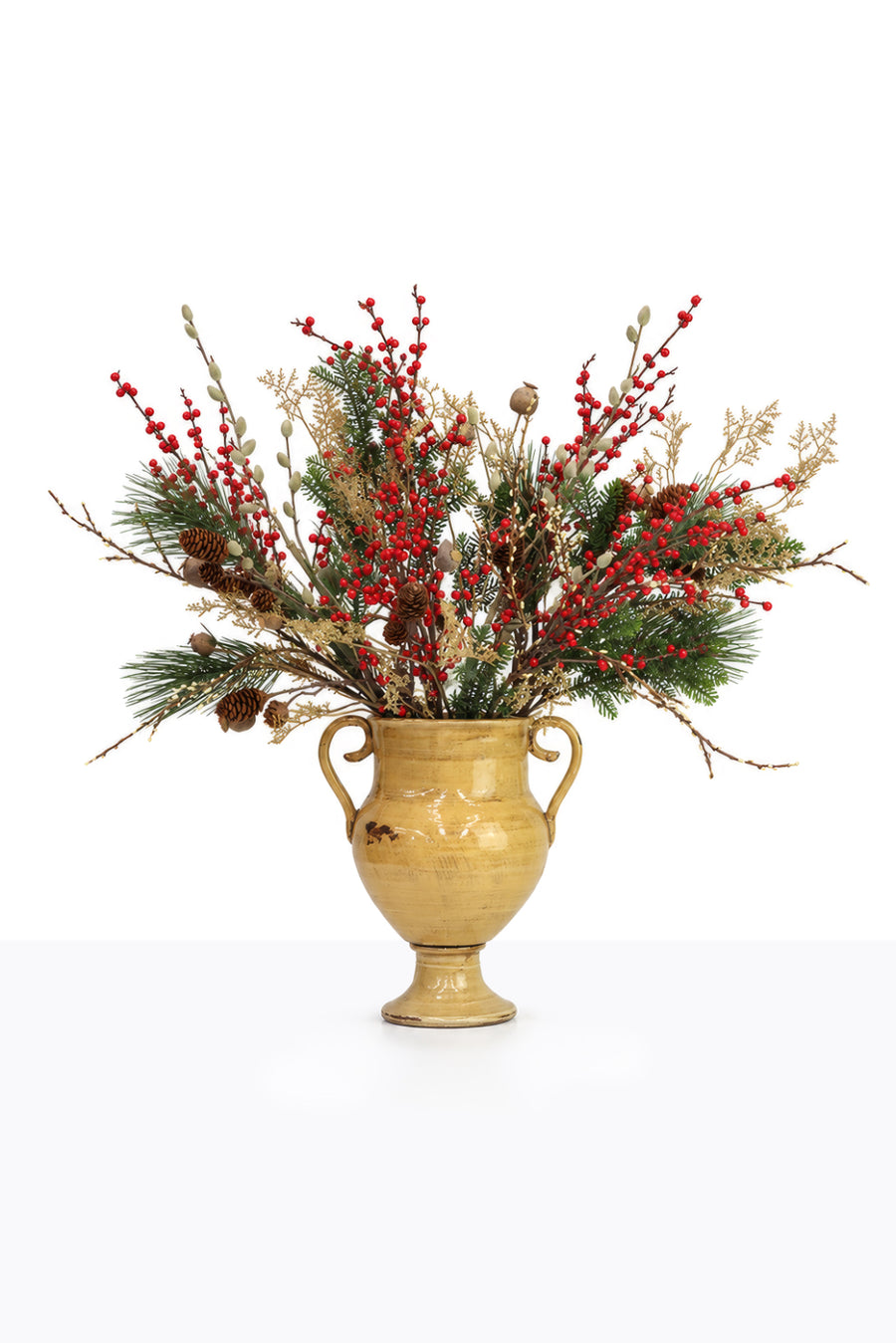 Artificial Christmas Red Berry Arrangement in a ceramic urn on white background
