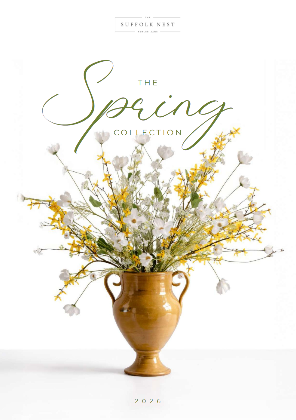 Yellow Vase with spring white artificial flowers labeled 'The Spring Collection' by Suffolk Nest on a white background