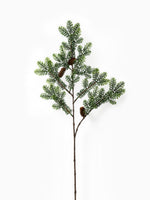 Artificial Green Spruce Branch on white background 
