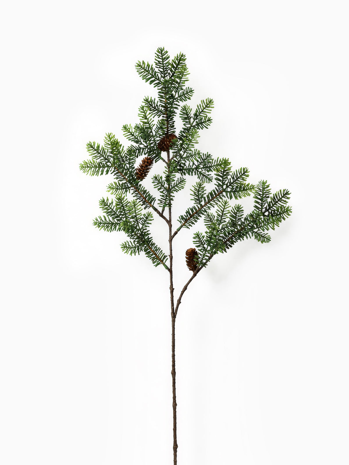 Artificial Green Spruce Branch on white background 