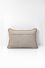Decorative pillow with wildflower print on a white background