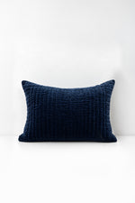 Decorative pillow with quilted velvet on a white background