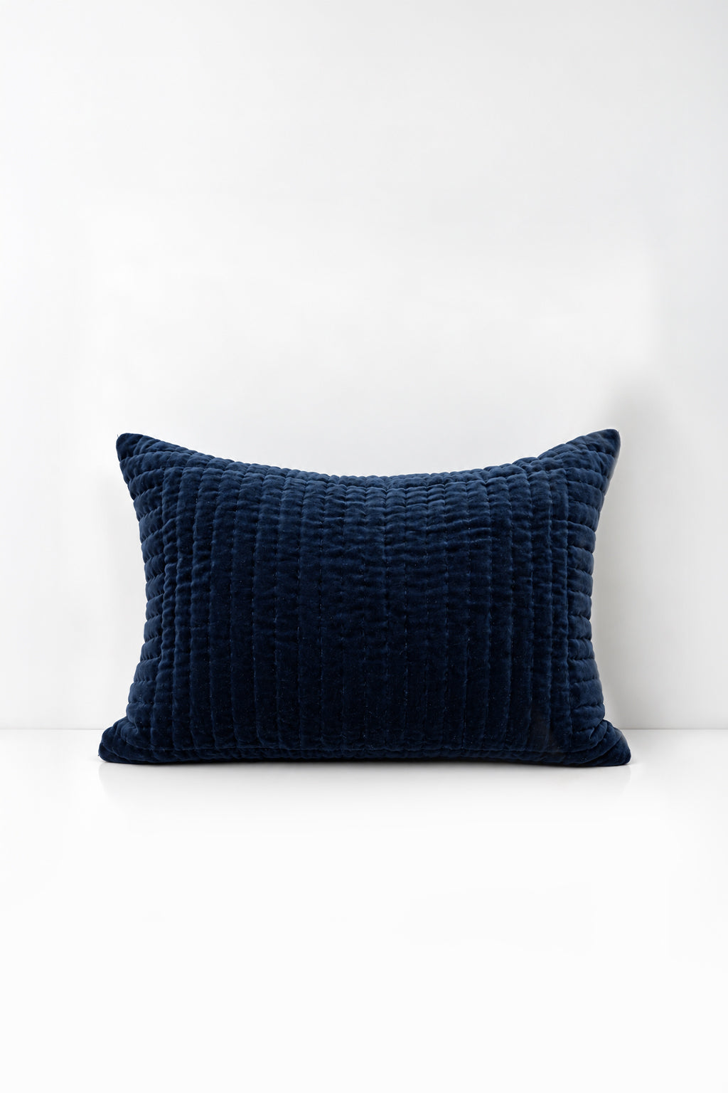 Decorative pillow with quilted velvet on a white background