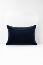 Decorative pillow with quilted velvet on a white background