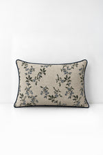 Decorative pillow with wildflower print on a white background