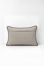 Decorative pillow with wildflower print on a white background