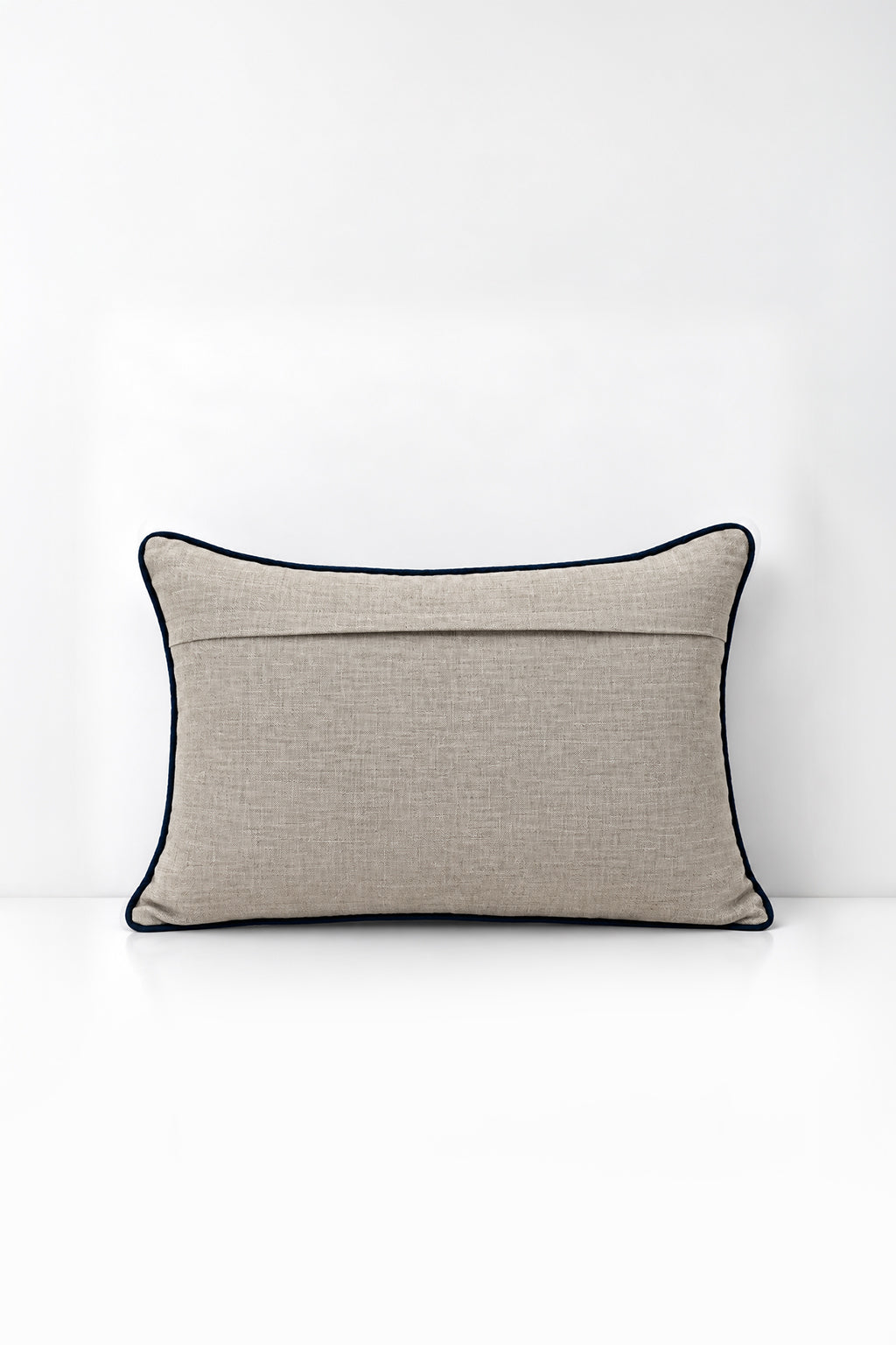 Decorative pillow with wildflower print on a white background