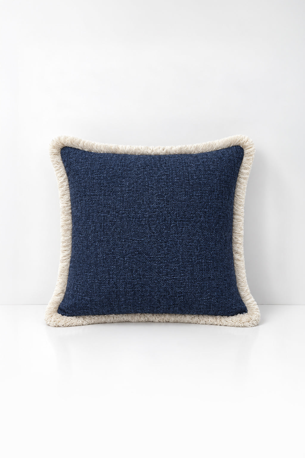 Blue Weave Fringe decorative cushion on a white background