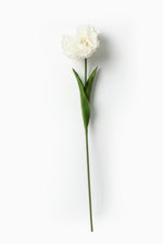 artificial Single white tulip with green stem on a light gray background