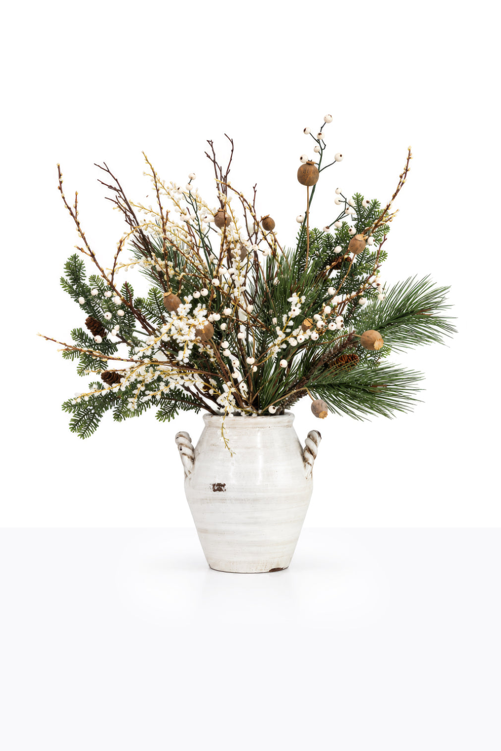 Artificial Christmas White Berry Arrangement in a ceramic urn on white background