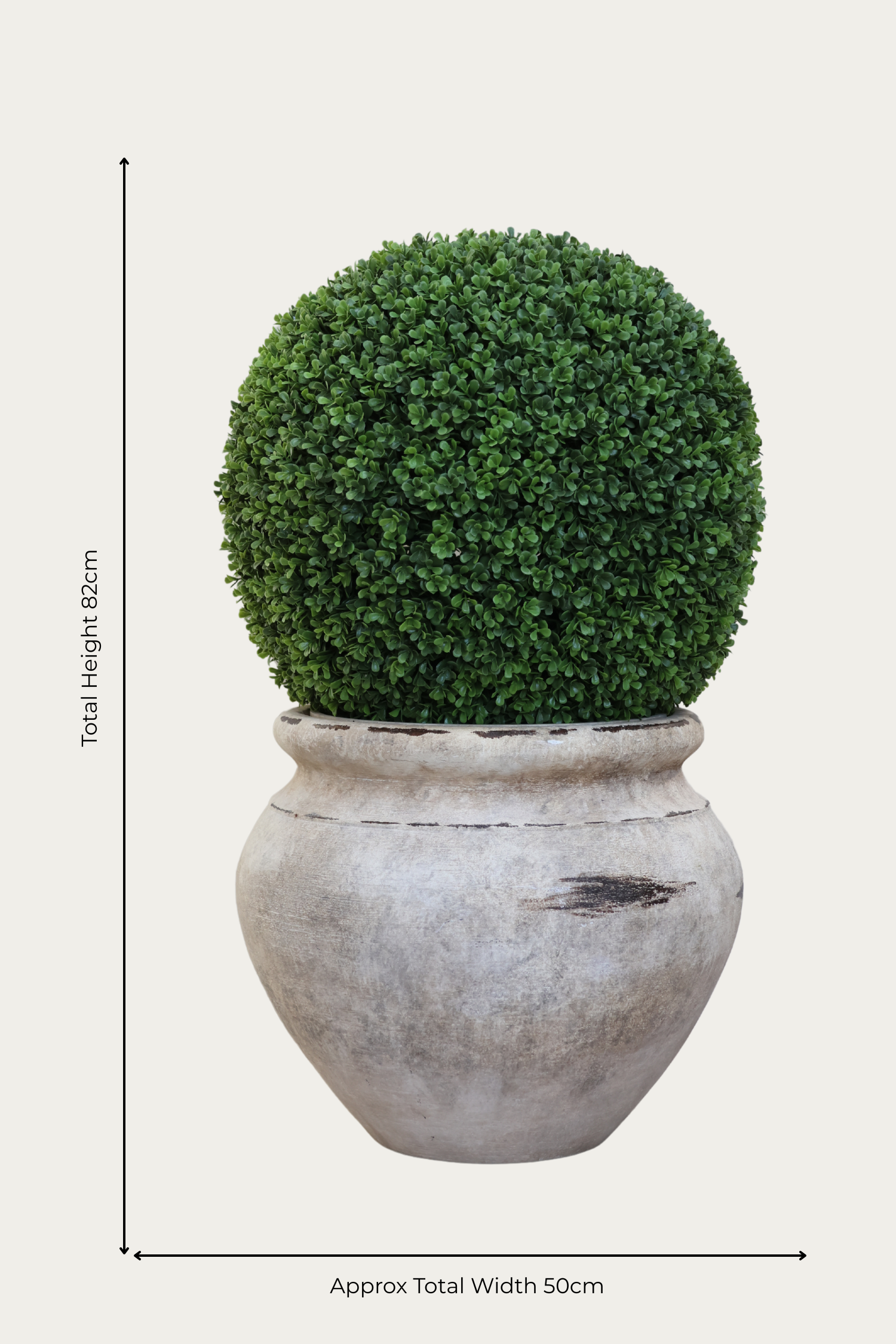 artificial buxus ball in barrow planter on white background 