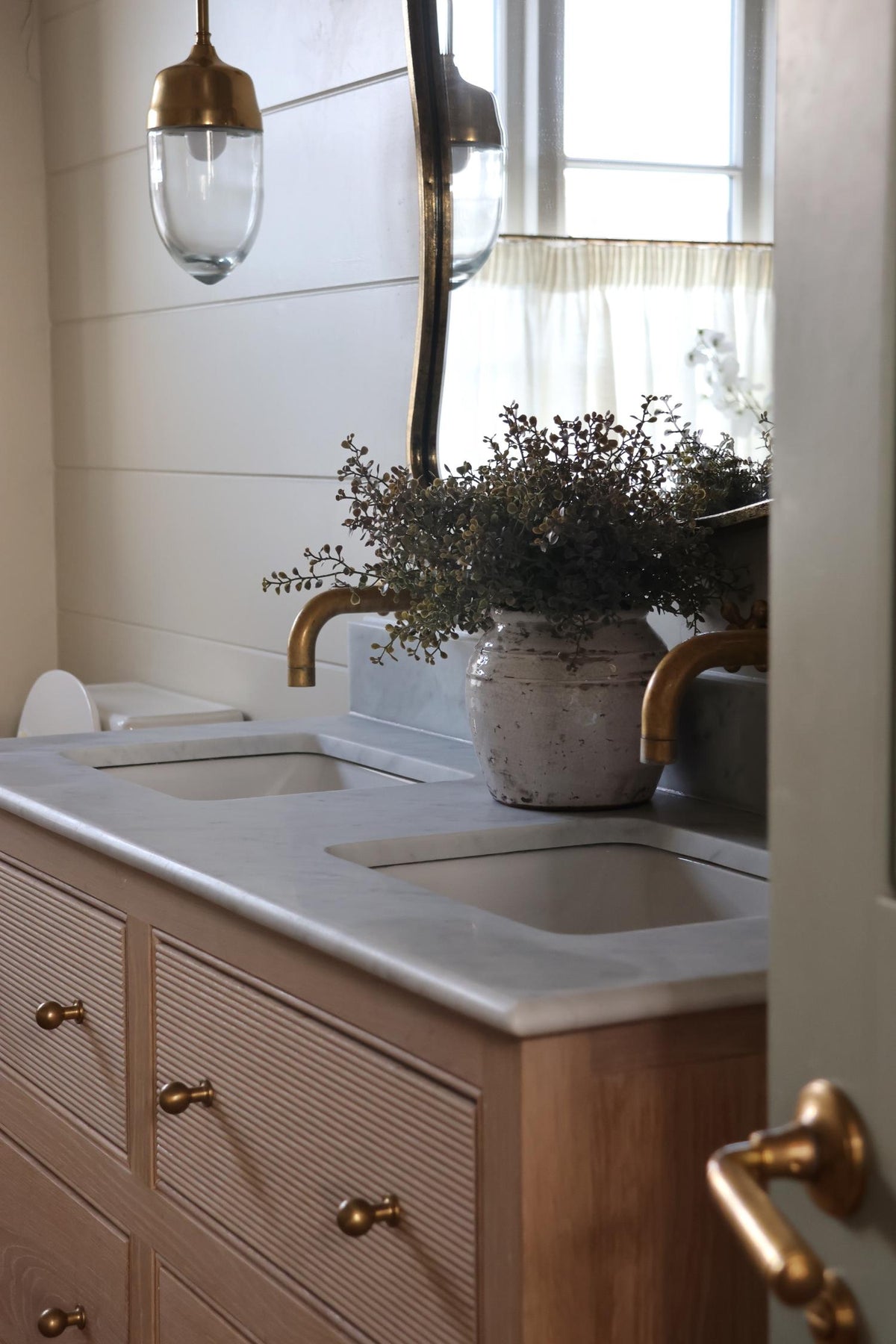 bathroom vanity unit with our bentley pot and eucalyptus bush styled in the centre 