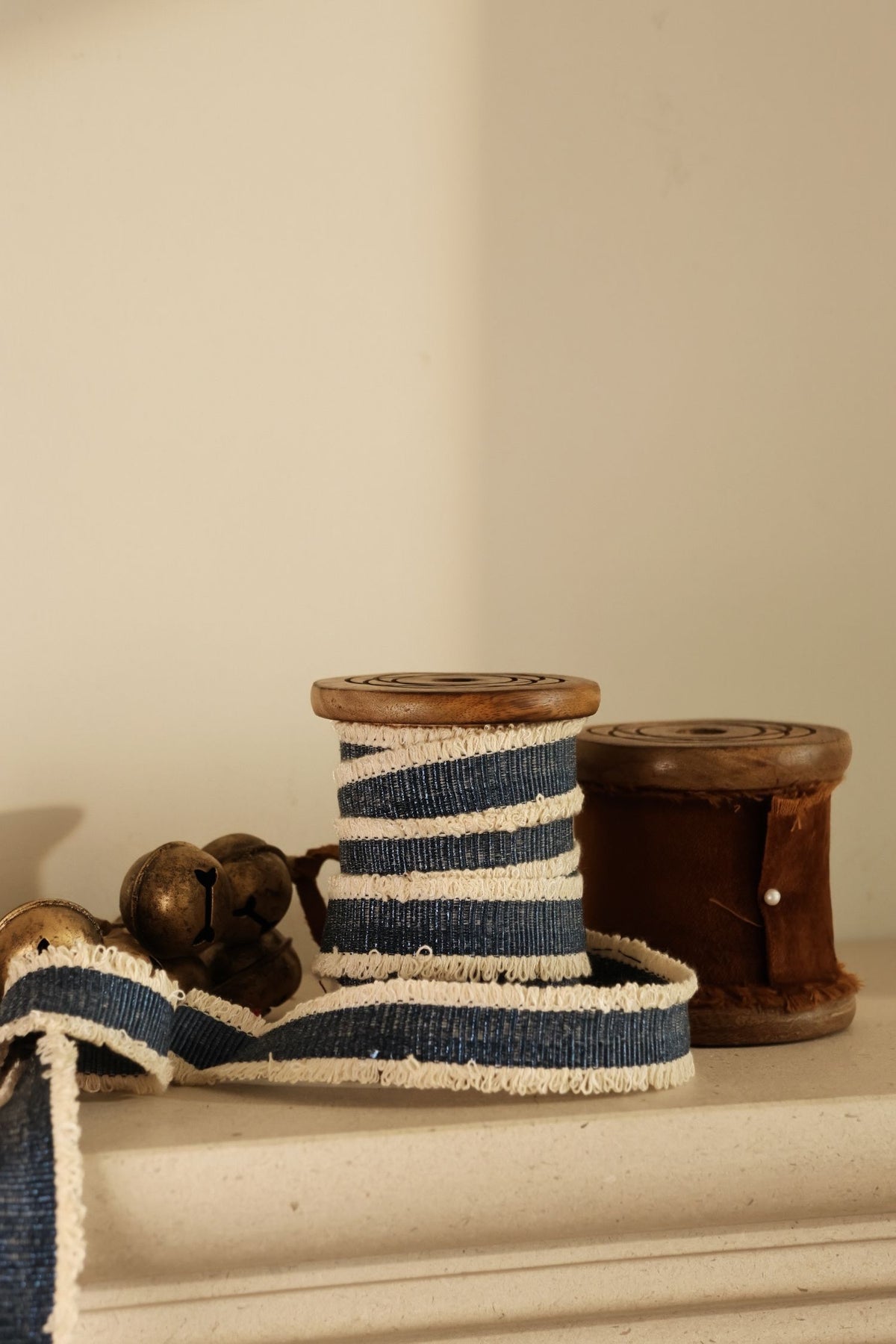blue decorative ribbon on wooden spool 