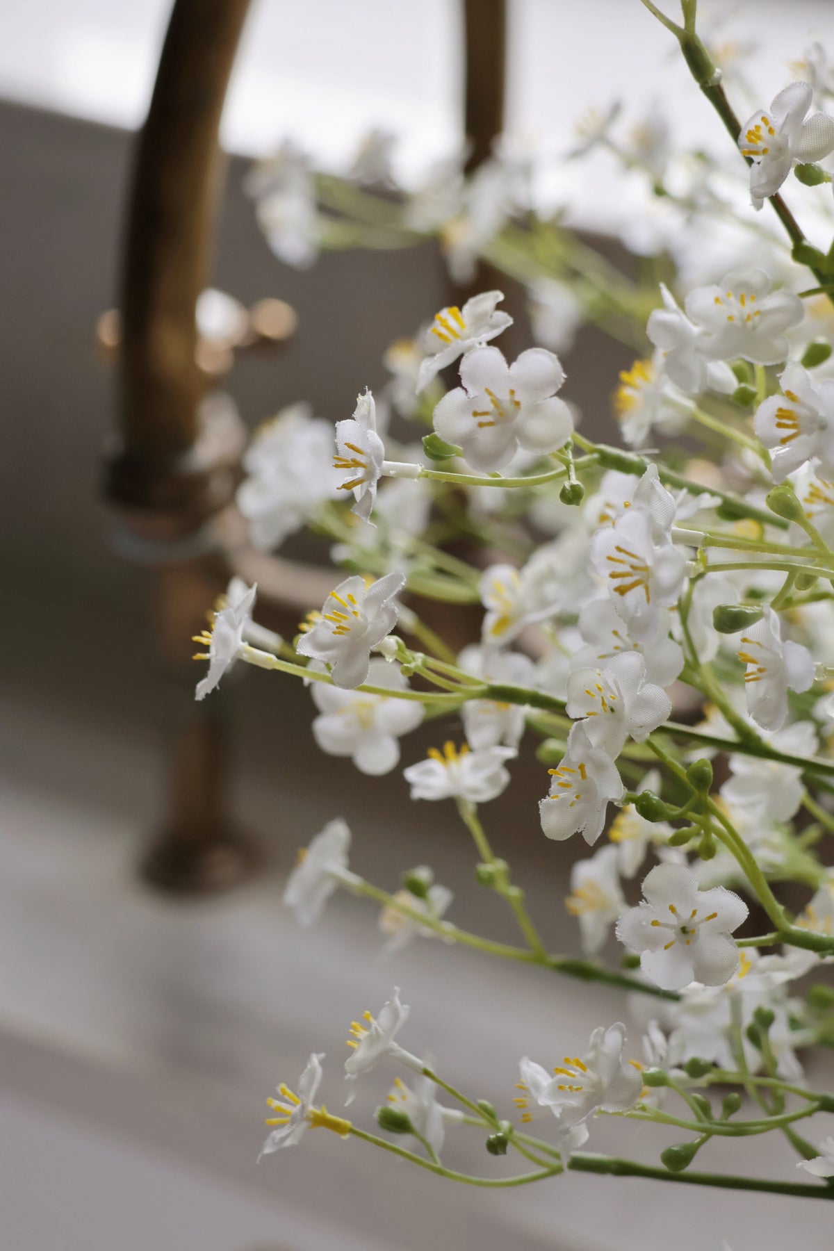 Close-up of white flowers with a blurred background faux forget me not stems