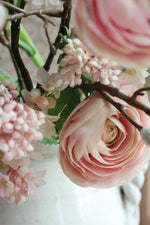 close up of pink flowers on white background