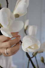 close up of petals on a faux white magnolia flower