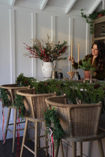 festive bar scene with faux red berry flower arrangement 