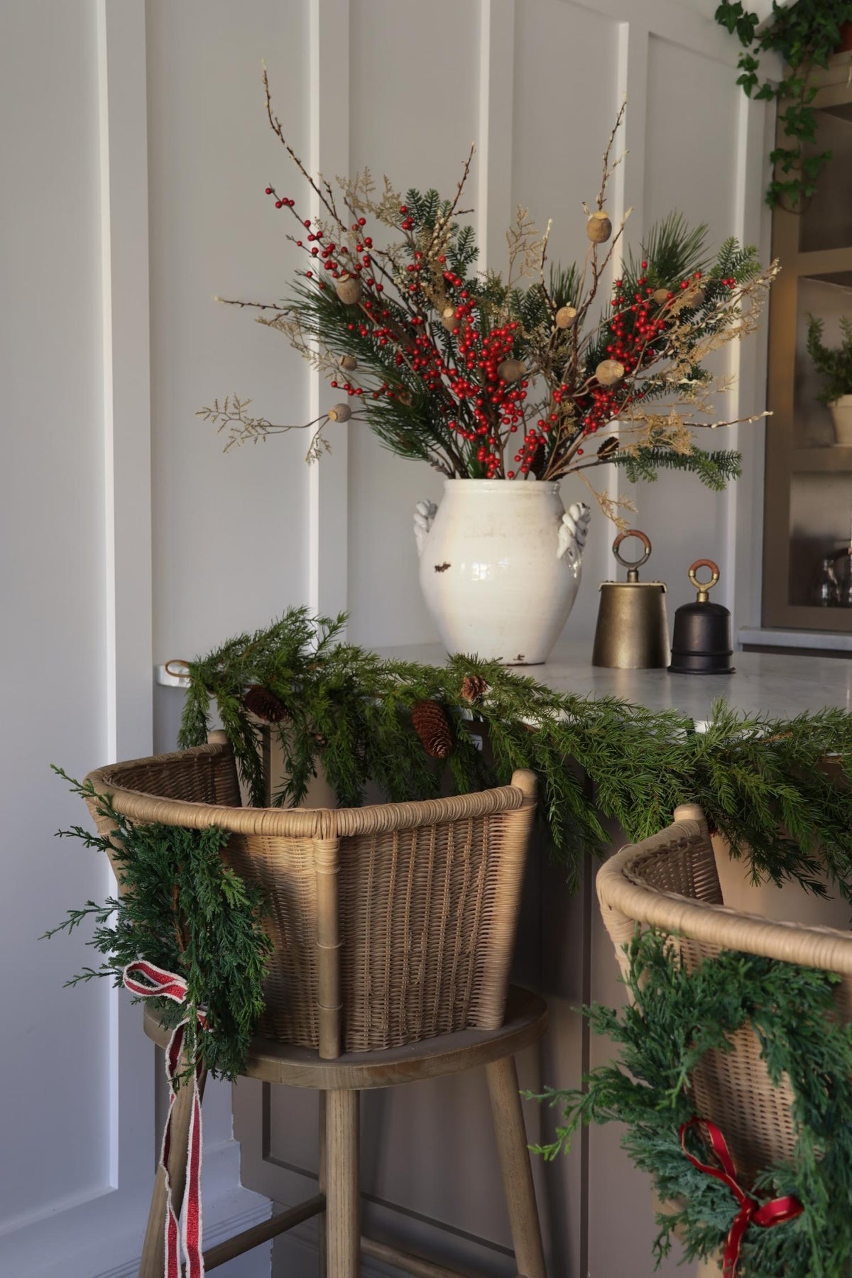 festive bar scene with faux red berry flower arrangement 