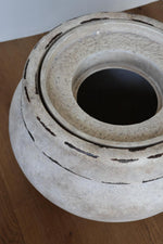 barrow planter with insert from a birds eye view on a wooden floor