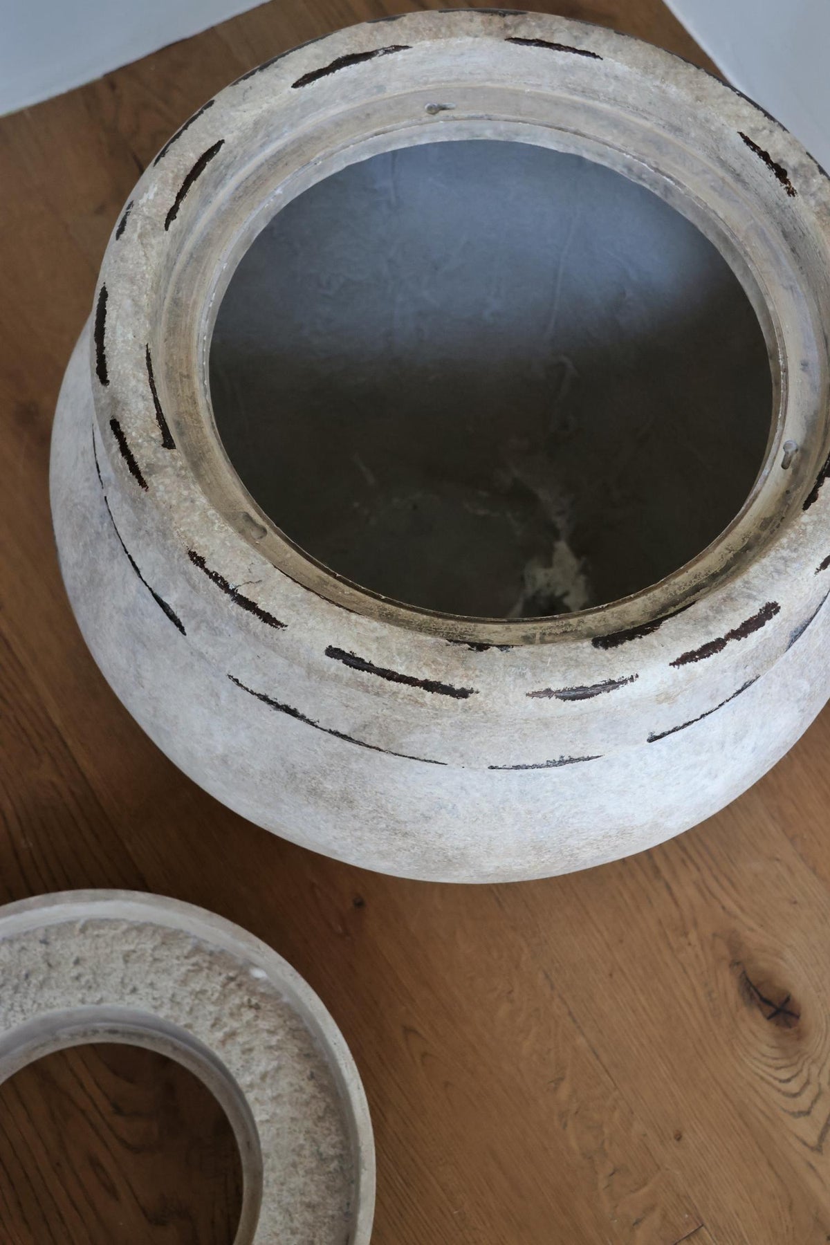 barrow planter and insert shown seperately on wooden floor