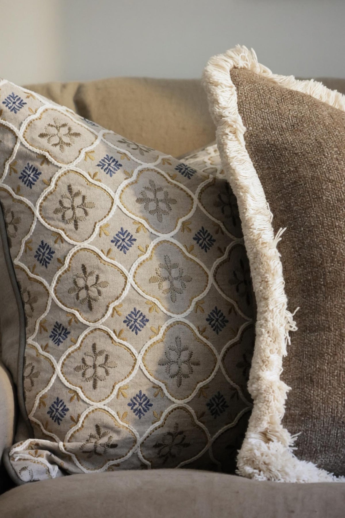 Decorative cushions with geometric pattern on a couch