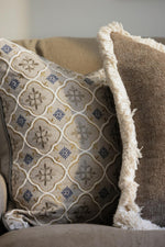 Decorative cushions with geometric pattern on a couch